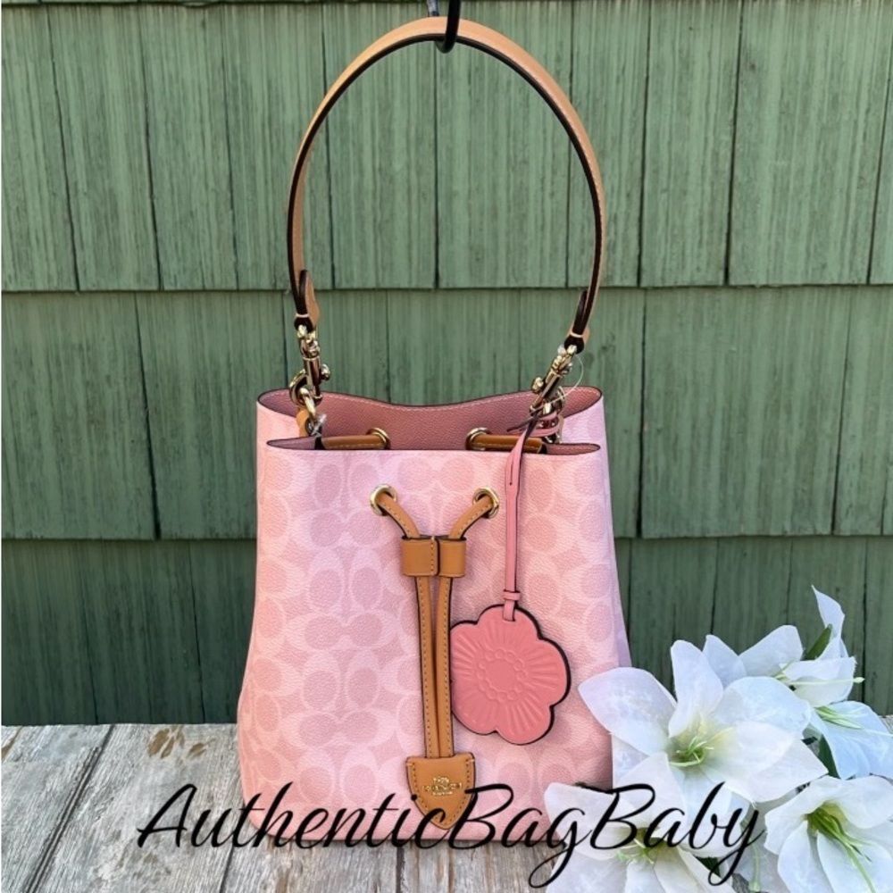 Coach Rowan Bucket Bag In Signature Canvas With Charm Powder Pink Purse